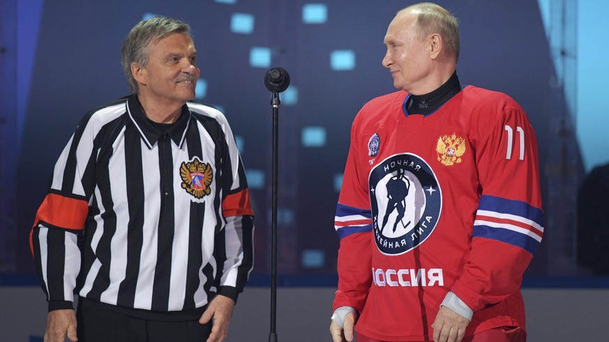 Russian President Vladimir Putin, right, and IIHF President Rene Fasel attend a gala match with the participation of Russian hockey legends as part of the final stage of the X All-Russian Night Hockey ...
