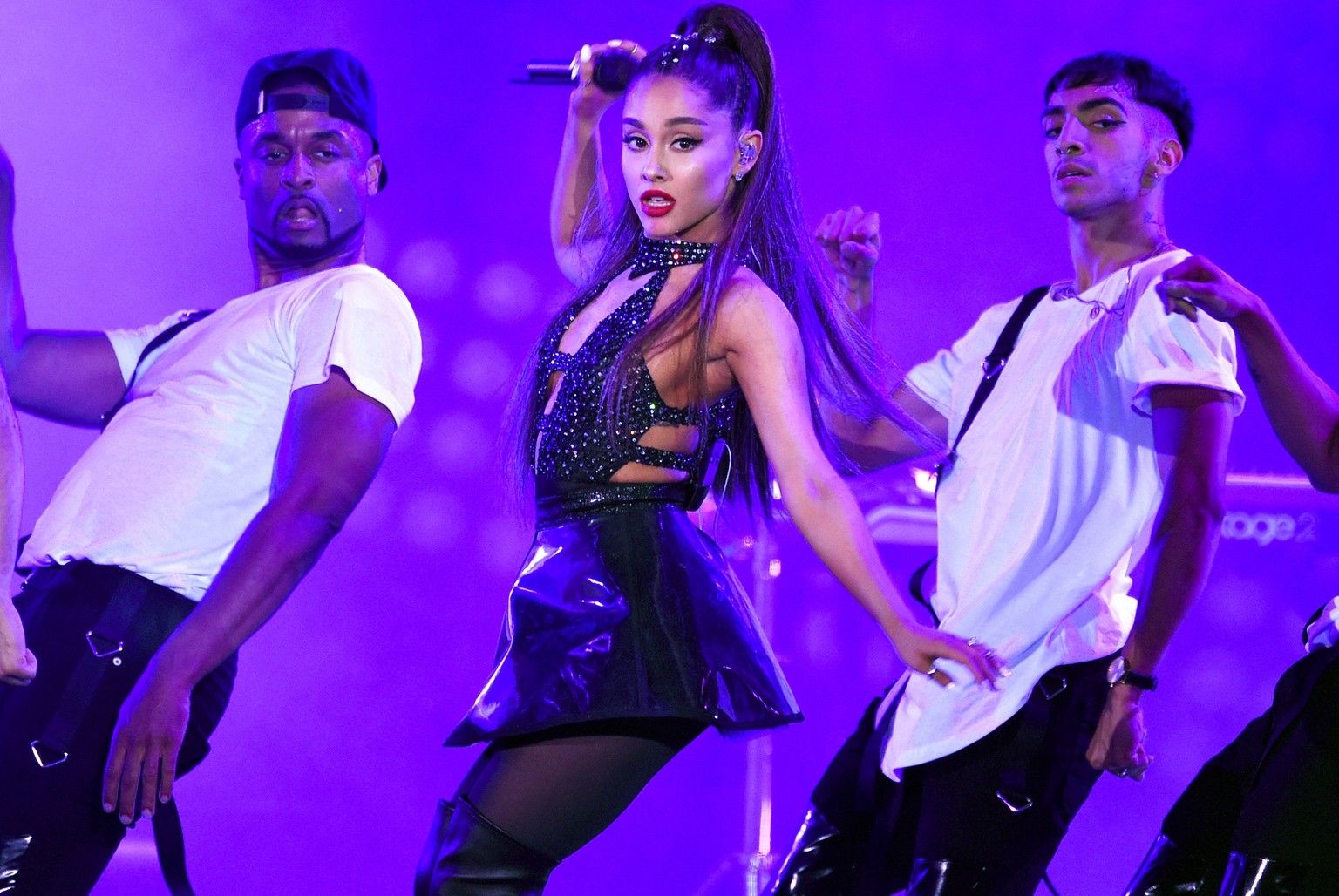 FILE - In this June 2, 2018 file photo, Ariana Grande, center, performs at Wango Tango in Los Angeles. Grande won her first Grammy Award on Sunday, Feb. 10, but the singer didn’t collect it after she  ...