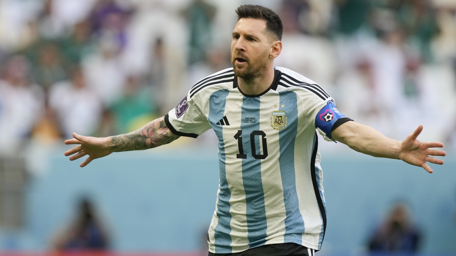 Argentina's Lionel Messi celebrates after scoring from the penalty spot his side's opening goal during the World Cup group C soccer match between Argentina and Saudi Arabia at the Lusail Stadium in Lu ...