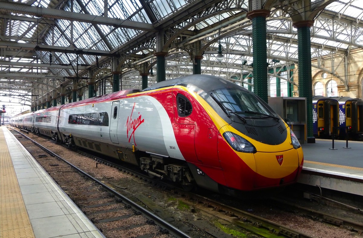 A Virgin train ready for boarding at Glasgow Central station in Scotland for travel to London Euston statio. xkwx glasgow, scotland, virgin, station, train, rail, uk, railway, transportation, travel,  ...