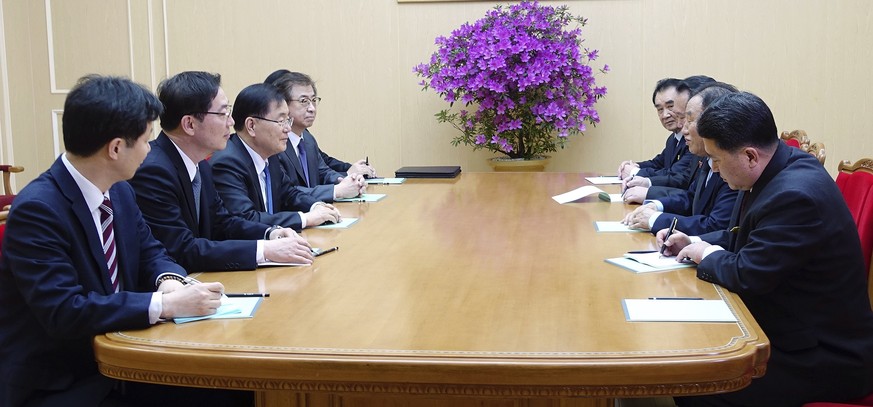 In this photo provided by South Korea Presidential Blue House via Yonhap News Agency, South Korean national security director, Chung Eui-yong, third from left, meets with North Korean vice chairman of ...