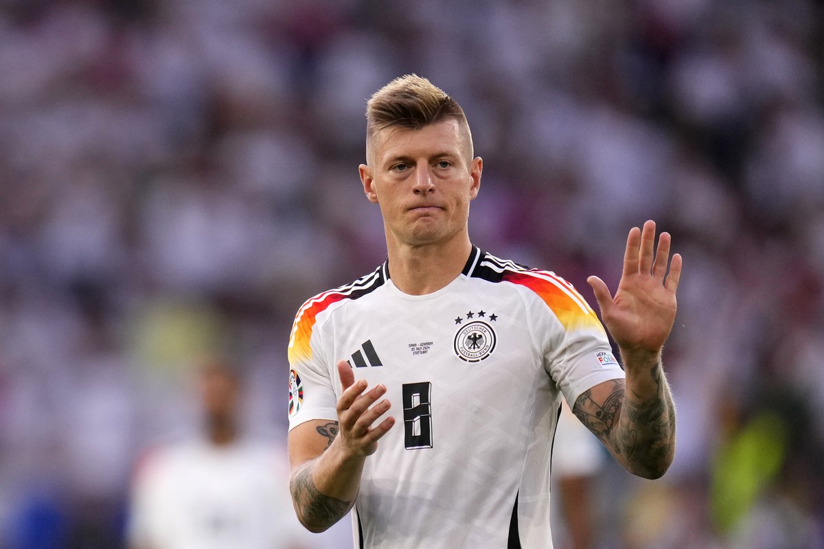 Germany's Toni Kroos walks off the pitch after a quarter final match between Germany and Spain at the Euro 2024 soccer tournament in Stuttgart, Germany, Friday, July 5, 2024. (AP Photo/Manu Ferna ...