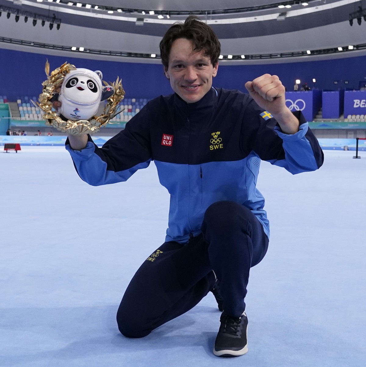 Nils van der Poel of Sweden celebrates during a venue ceremony after winning the gold medal and breaking his own world record in the men's speedskating 10,000-meter race at the 2022 Winter Olympi ...
