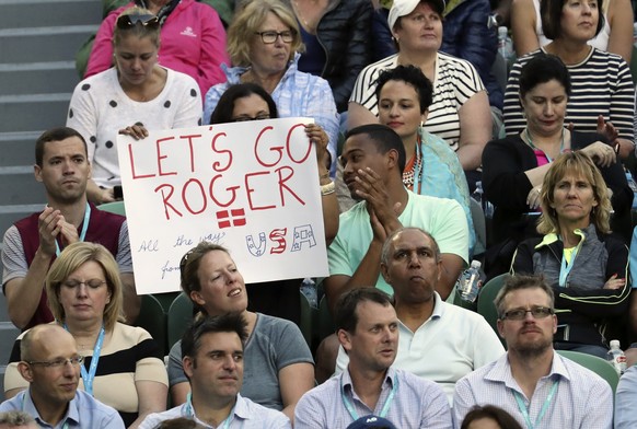 A fan holds up a banner in support of Switzerland&#039;s Roger Federer during his quarterfinal against Germany&#039;s Mischa Zverev at the Australian Open tennis championships in Melbourne, Australia, ...