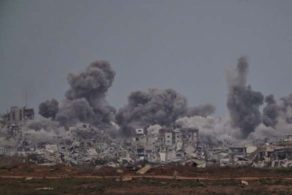 Smoke rises to the sky following an Israeli military strike in the Gaza Strip, as seen from southern Israel, Thursday, Oct. 9, 2025, following the announcement that Israel and Hamas have agreed to the ...