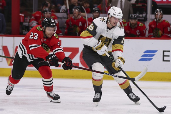 Vegas Golden Knights left wing Pavel Dorofeyev (16) controls the puck against Chicago Blackhawks center Philipp Kurashev (23) during the second period of an NHL hockey game Friday, March 28, 2025, in  ...