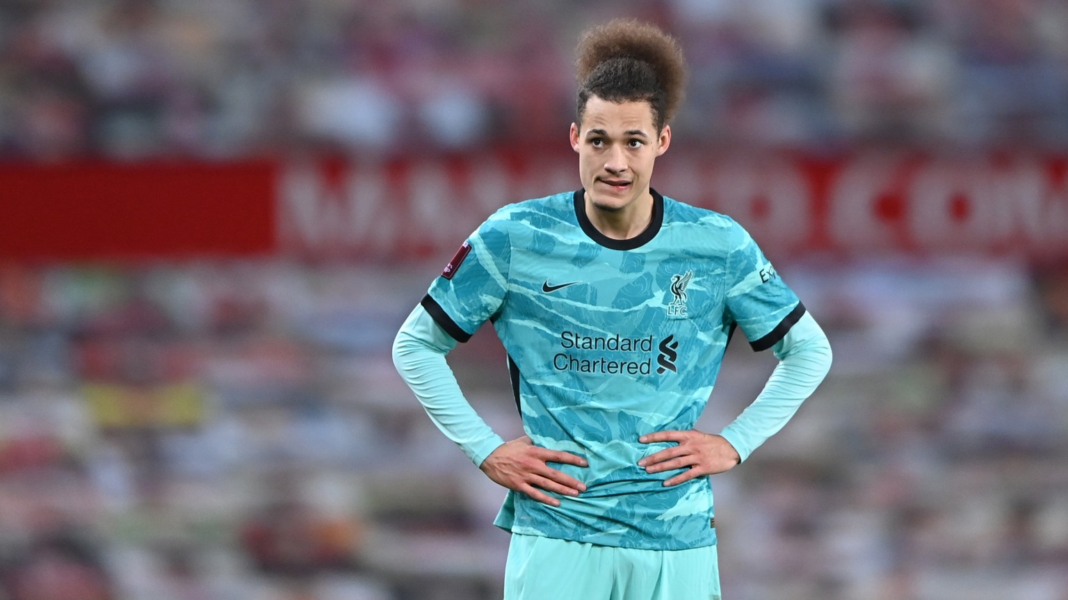 epa08962990 Rhys Williams of Liverpool reacts during the English FA Cup fourth round soccer match between Manchester United and Liverpool in Manchester, Britain, 24 January 2021. EPA/Laurence Griffith ...