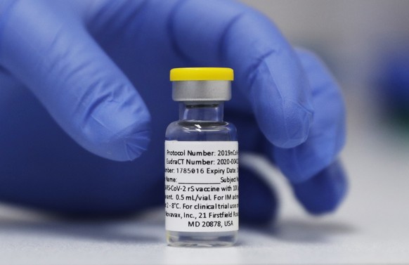 FILE - A vial of the Phase 3 Novavax coronavirus vaccine prepared for use in a trial at St. George&#039;s University hospital in London, Oct. 7, 2020. The Novavax COVID-19 vaccine that could soon win  ...