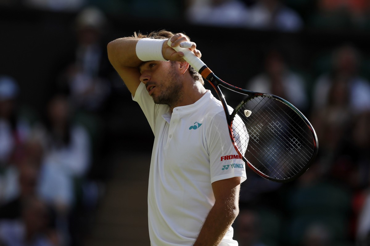 Switzerland's Stan Wawrinka reacts during his Men's Singles Match against Russia's Daniil Medvedev on the opening day at the Wimbledon Tennis Championships in London Monday, July 3, 201 ...