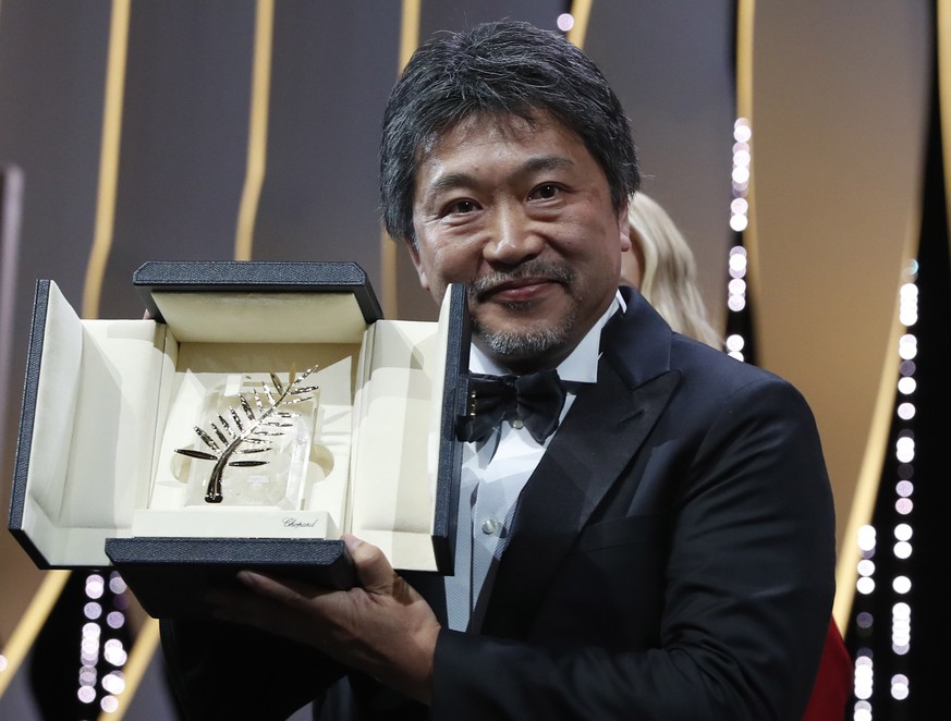 epa06750842 Hirozaku Kore-Eda accepts the Palm d&#039;Or (Golden Palm) for the movie &#039;Shoplifters (Manbiki Kazoku)&#039; during the Closing Awards Ceremony of the 71st Cannes Film Festival, in Ca ...