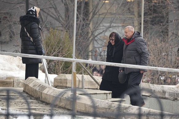 Anatoly Navalny, right, and Lyudmila Navalnaya, parents of Russian opposition leader Alexei Navalny walk to the Church of the Icon of the Mother of God Soothe My Sorrows, in Moscow, Russia, Friday, Ma ...