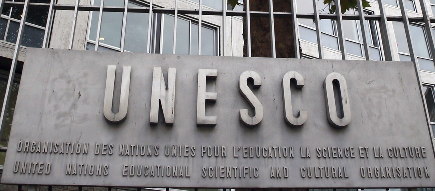 FILE - In this Monday Oct. 17, 2016 file picture, the United Nations Educational Scientific and Cultural Organization logo is pictured on the entrance at UNESCO&#039;s headquarters in Paris. U.S. offi ...