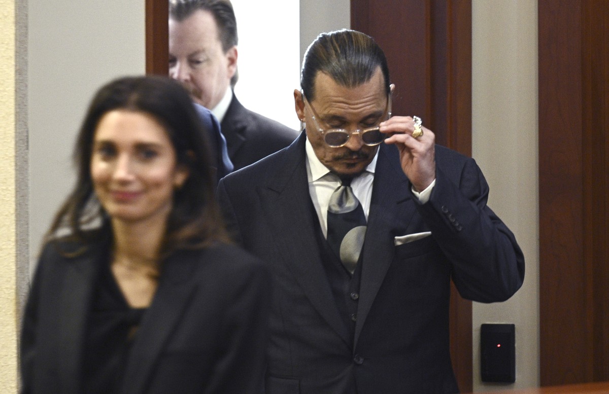 Actor Johnny Depp arrives in the courtroom at the Fairfax County Circuit Court in Fairfax, Va., Tuesday, April 26, 2022. Depp sued his ex-wife actress Amber Heard for libel in Fairfax County Circuit C ...