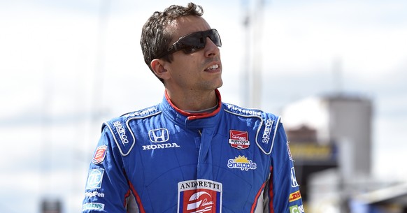 Justin Wilson, of England, walks on pit road during qualifying for Sunday&#039;s Pocono IndyCar 500 auto race, Saturday, Aug. 22, 2015, in Long Pond, Pa. Wilson was injured during Sunday&#039;s race a ...