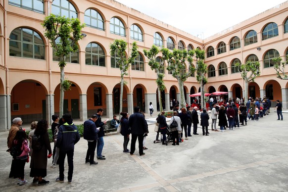 epa07533877 People queue to vote at a polling station during general elections in Barcelona, Spain, 28 April 2019. Nearly 36.9 million people are called to vote in the third general elections in four  ...