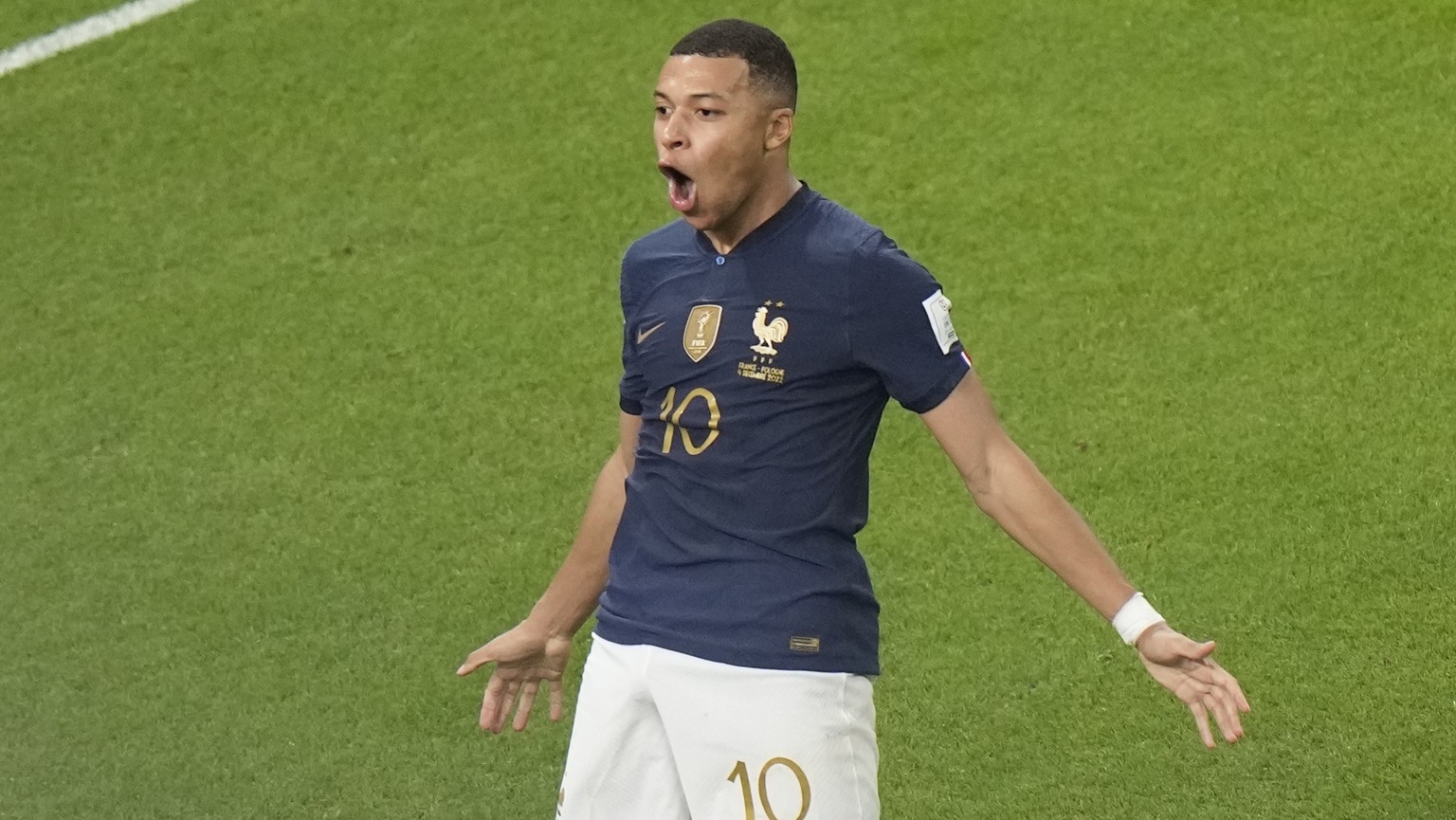 France&#039;s Kylian Mbappe, left, celebrates after scoring the third goal for his side during the World Cup round of 16 soccer match between France and Poland, at the Al Thumama Stadium in Doha, Qata ...