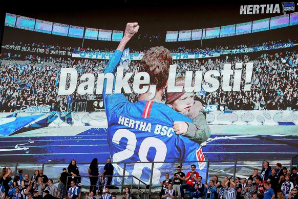 epa07580813 Berlin's Fabian Lustenberger appears on a huge screen before the German Bundesliga soccer match between Hertha BSC and Bayer Leverkusen in Berlin, Germany, 18 May 2019. EPA/HAYOUNG JE ...