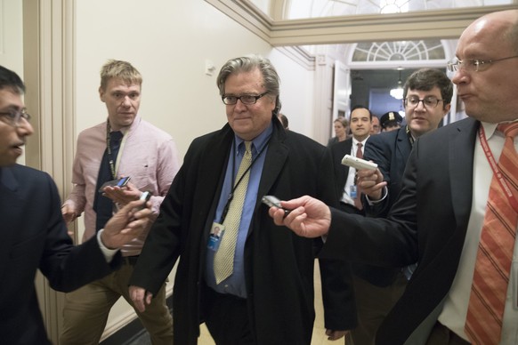 epa05890450 (FILE) - White House Chief Strategist Steve Bannon (C) is followed by reporters as he leaves a Republican conference meeting on Capitol Hill in Washington, DC, USA, 23 March 2017 (reissued ...