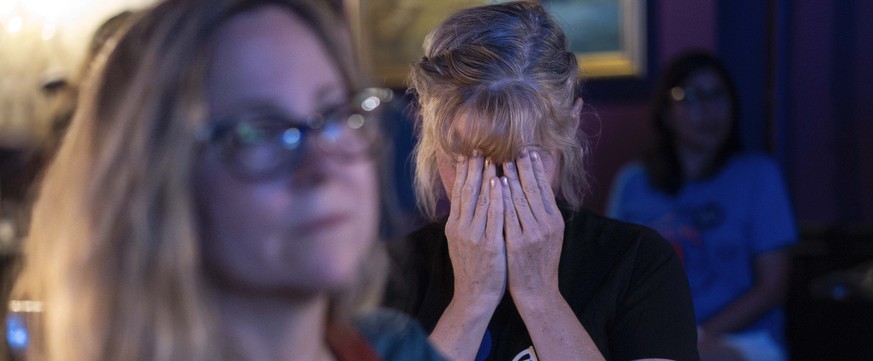 Tonya Morris, from Cincinnati, reacts during the presidential debate between President Joe Biden and Republican presidential candidate former President Donald Trump at Tillie&#039;s Lounge on Thursday ...