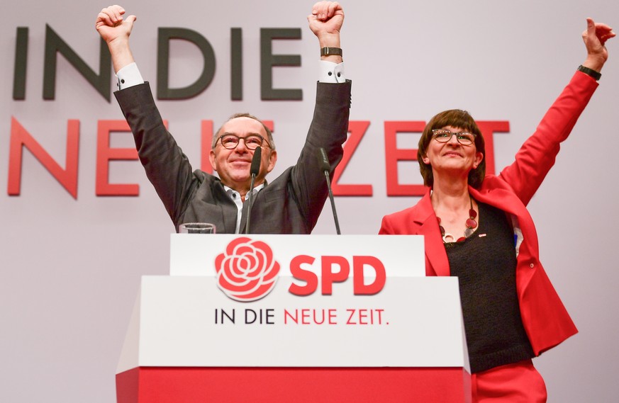 epa08049059 New Social Democratic Party (SPD) co-chairs Saskia Esken (R) and Norbert Walter-Borjans react after their election during the SPD party convention at CityCube in Berlin, Germany, 06 Decemb ...