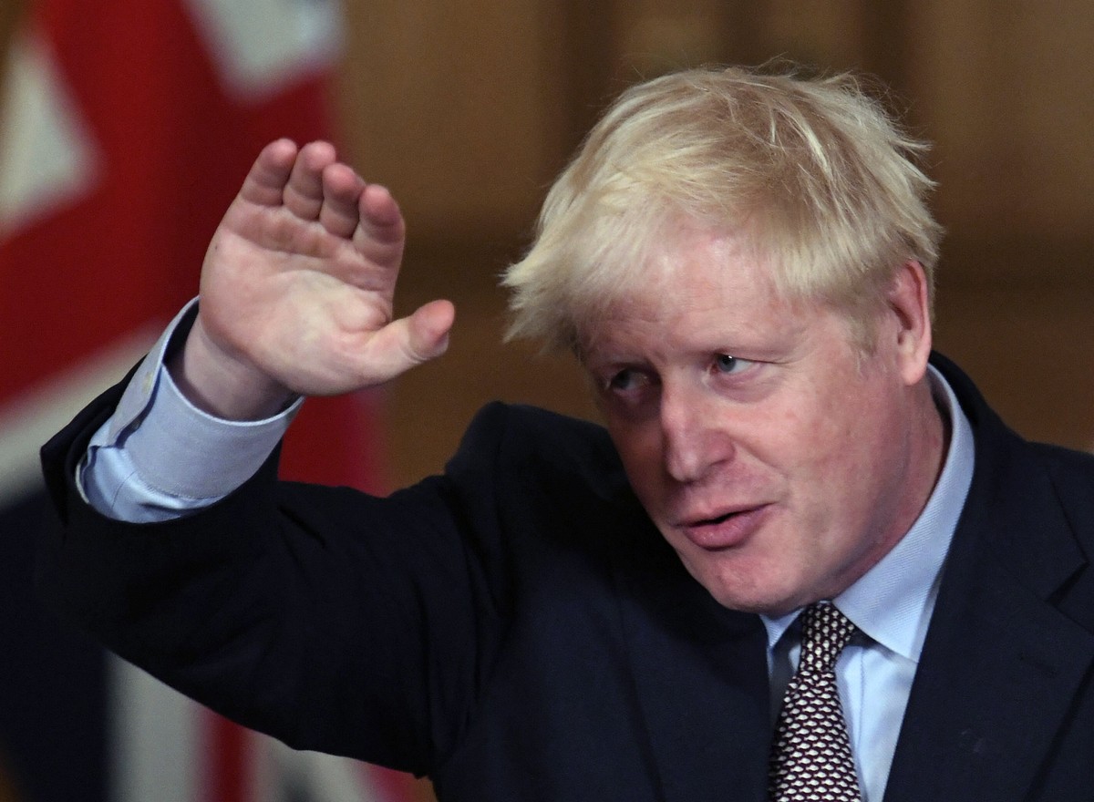 Britain's Prime Minister Boris Johnson reacts during a virtual press conference at Downing Street in London, Wednesday Sept. 9, 2020, following the announcement that the legal limit on social gat ...