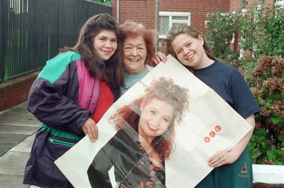 Left to right family members Donna Evans, Nan Kate Evans and Angela Evans. They hold a poster of Sonia. Picture taken in Liverpool. 14th May 1993. The family of singer Sonia Evans, from Liverpool, che ...