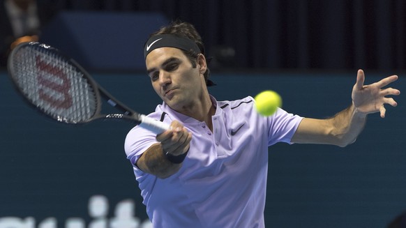 epa06286882 Switzerland&#039;s Roger Federer in action during his first round match against USA&#039;s Frances Tiafoe at the Swiss Indoors tennis tournament in Basel, Switzerland, 24 October 2017. EPA ...