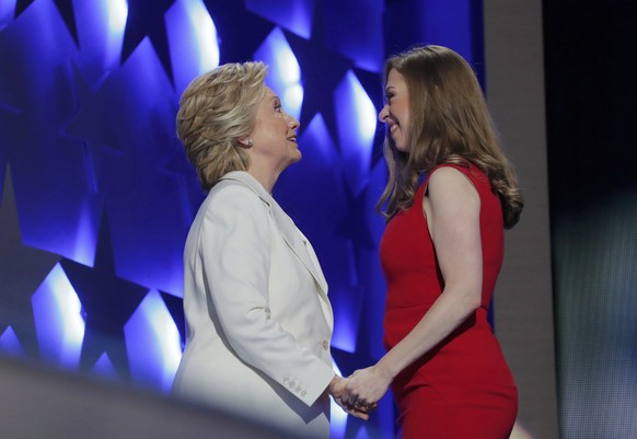 Democratic presidential nominee Hillary Clinton talks with her daughter Chelsea as she arrives to accept the nomination on the fourth and final night at the Democratic National Convention in Philadelp ...