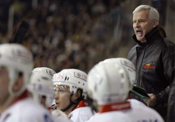 Dave King of Canada, head coach of Metallurg talks to his players during the 79th Spengler Cup tournament ice hockey match HC Davos against HC Metallurg Magnitogorsk in Davos, Switzerland, Wednesday,  ...