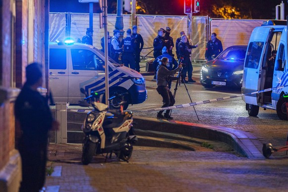 Police and inspectors work in an area where a shooting took place in the center of Brussels on Monday, October 1.  August 16, 2023. Belgian police say two people are dead in the center of Brussels after several shots...