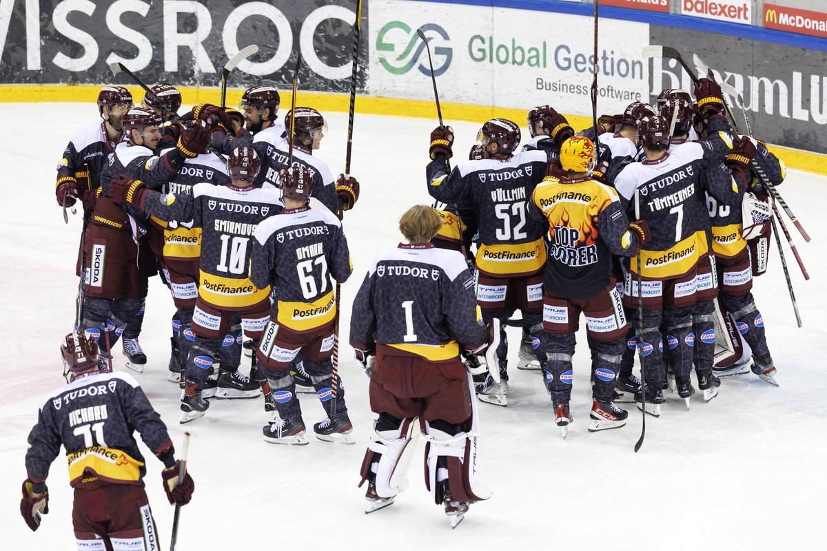 Geneve-Servette's players celebrate their victory after defeating the team Lausanne at the shootout session, during the National League regular season game of the Swiss Championship between Genev ...