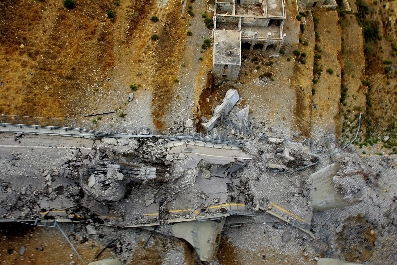 The destroyed Mdeirej bridge which was damaged during the 34-day long Hezbollah-Israeli conflict, on the main highway between Beirut and Damascus, east of Beirut, Lebanon, Tuesday Sept. 26, 2006. Some ...