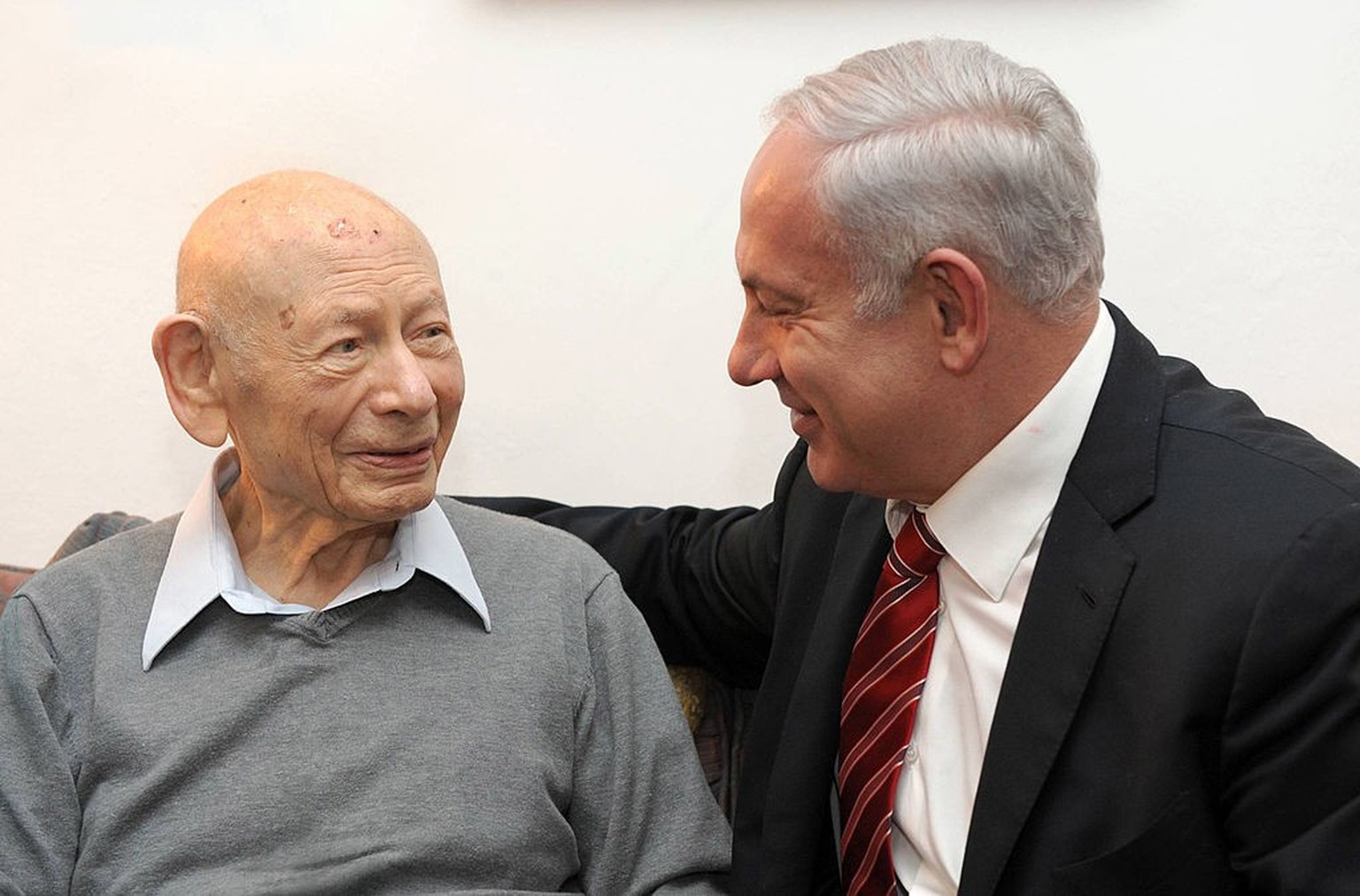 2012: (ISRAEL OUT) In this handout photo released by the Israeli Government Press Office (GPO), Israeli Prime Minister Benjamin Netanyahu (R) sits with his father Professor Benzion Netanyahu on March  ...