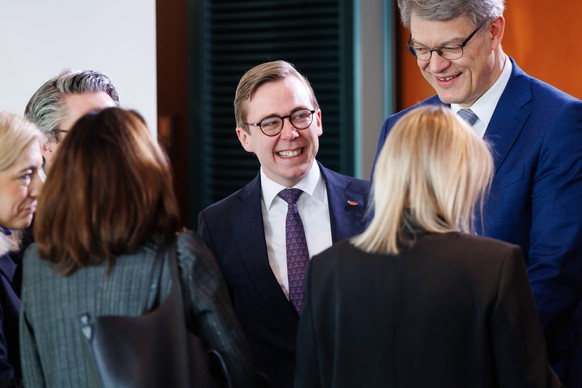 epa12667011 Parliamentary State Secretary at the German Digitalization Ministry Philipp Amthor (C) talks with colleagues, among them German Transport Minister Patrick Schnieder (R) and German Health M ...
