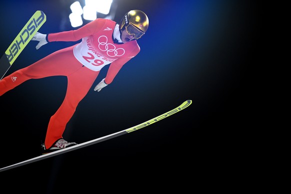 epa09732253 Gregor Deschwanden of Switzerland during the Men&#039;s Ski Jumping Normal Hill trial round at the Zhangjiakou National Ski Jumping Centre at the Beijing 2022 Olympic Games, Zhangjiakou, C ...