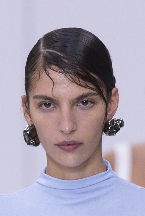 epa11624921 Models present creations from the Womenswear Spring/Summer 2025 collection of Acne Studios during the Paris Fashion Week, in Paris, France, 25 September 2024. The presentation of the Women ...