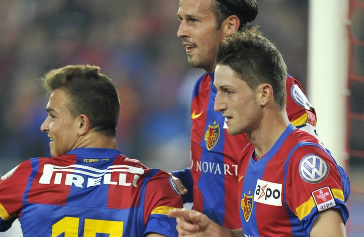 Basel's Xherdan Shaqiri, Marco Streller and Stephan Andrist, from left, celebrate during the Super League soccer match between FC Basel and Grasshopper Club Zuerich at the St. Jakob-Park stadium  ...