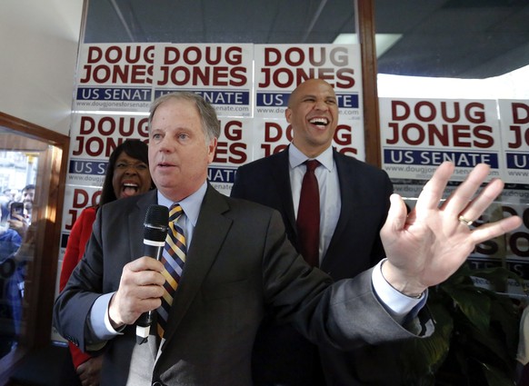 Democratic senatorial candidate Doug Jones, center, speaks during a campaign rally along side Sen. Cory Booker, D-N.J., right, and Rep. Terri Sewell, left, Sunday, Dec. 10, 2017, in Birmingham, Ala. ( ...