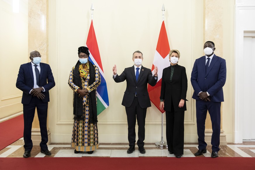 epa08932871 Yankuba Sonko, Interior Minister of the Republic of Gambia (L), Isatou Touray, Vice President of the Republic of Gambia (2-L), Ignazio Cassis, Swiss Minister of Foreign Affairs (C), Karin  ...