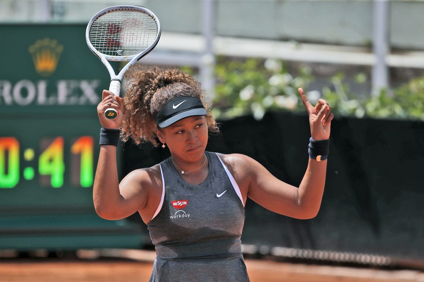 Naomi Osaka of Japan reacts after losing a point against Jessica Pegula of the United States during their match at the Italian Open tennis tournament, in Rome, Wednesday, May 12, 2021. Osaka lost agai ...