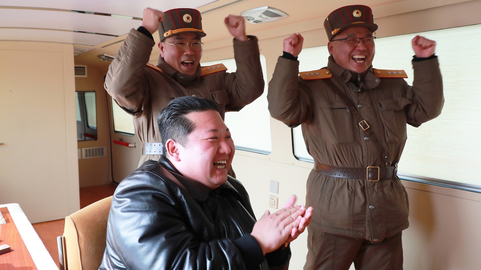 epa09848042 A photo released by the official North Korean Central News Agency (KCNA) shows Kim Jong Un (C), general secretary of the Workers' Party of Korea, president of the State Affairs of the ...
