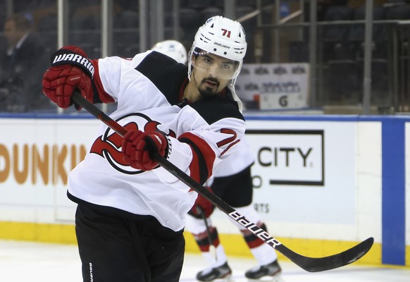 New Jersey Devils&#039; Jonas Siegenthaler shoots during warmups prior to an NHL hockey game against the New York Rangers, Thursday, April 15, 2021, in New York. (Bruce Bennett/Pool Photo via AP)