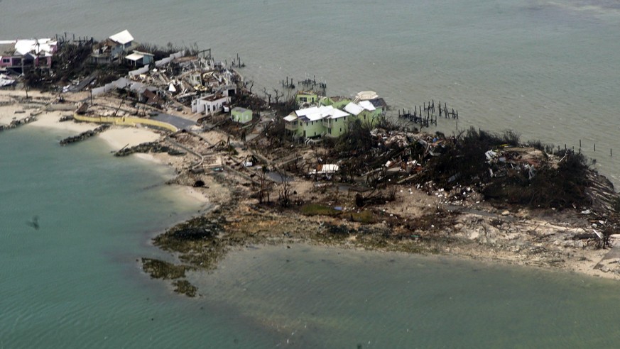epa07815879 A handout photo made available by the US Coast Guard shows an aerial view of a row of damaged structures in the Bahamas, 03 September 2019, seen from a Coast Guard Elizabeth City C-130 air ...