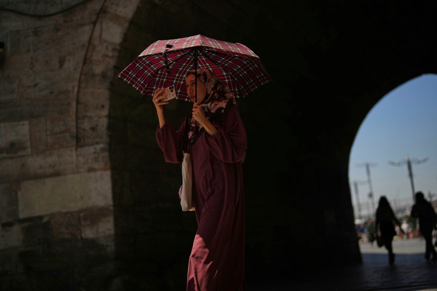 A woman uses an umbrella to shelter from the sun during a hot summer day in Istanbul, Turkey, Wednesday, July 9, 2025. (AP Photo/Francisco Seco)
Turkey Extreme Weather Heat