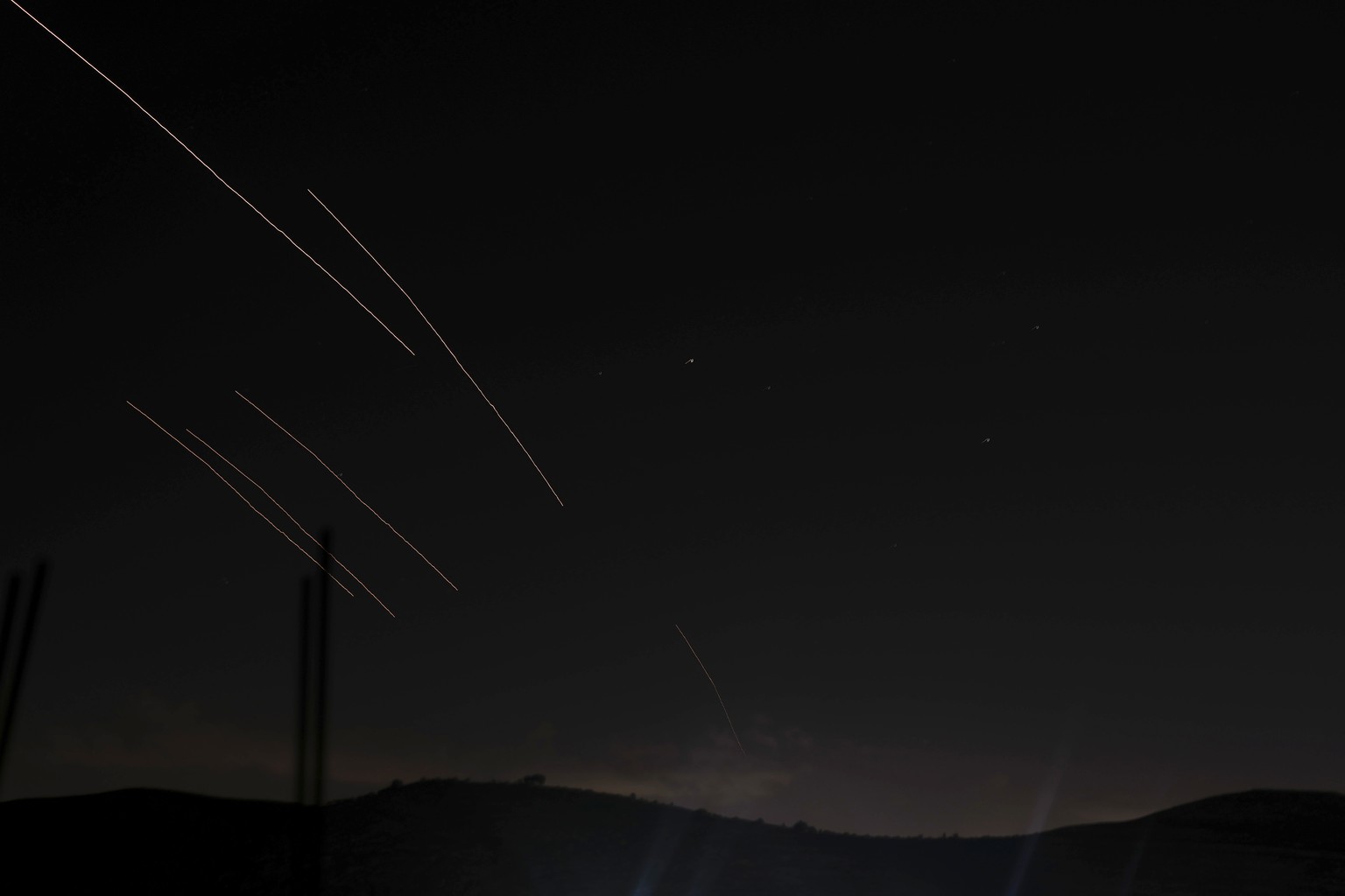 Rockets are launched from Iran streak across the night sky towards Israel, are seen in the West Bank city of Nablus, Tuesday, Oct. 1, 2024. (AP Photo/Majdi Mohammed)