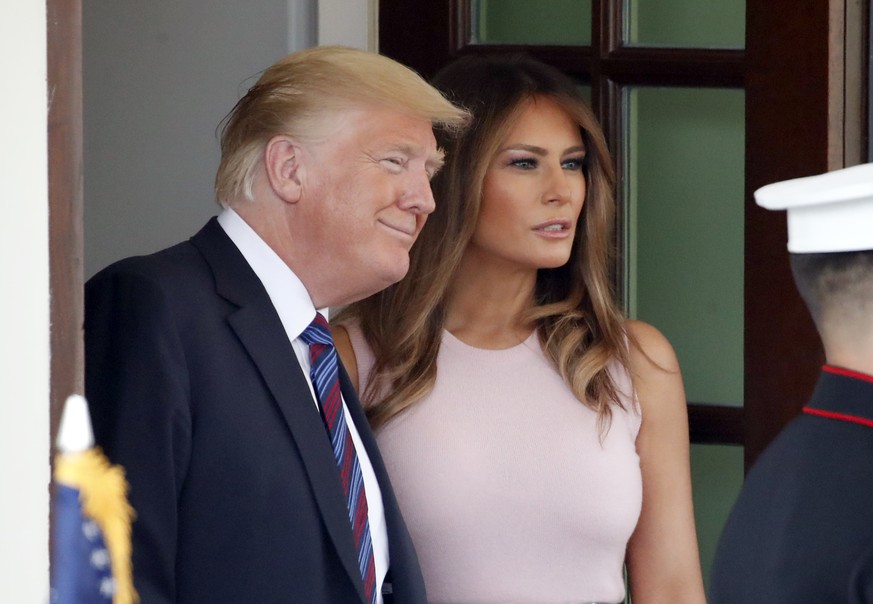 President Donald Trump, with first lady Melania Trump, smiles as Kenyan President Uhuru Kenyatta departs the White House, Monday, Aug. 27, 2018, in Washington. (AP Photo/Alex Brandon)