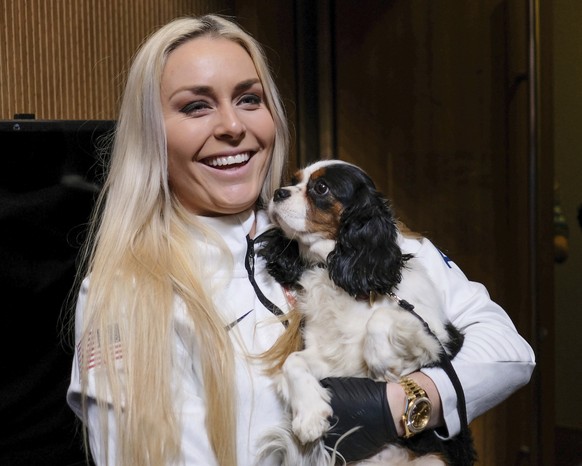 United States alpine skier Lindsey Vonn holds her dog Lucy after a press conference at the 2018 Winter Olympics in Pyeongchang, South Korea, Friday, Feb. 9, 2018. (AP Photo/J. David Ake)