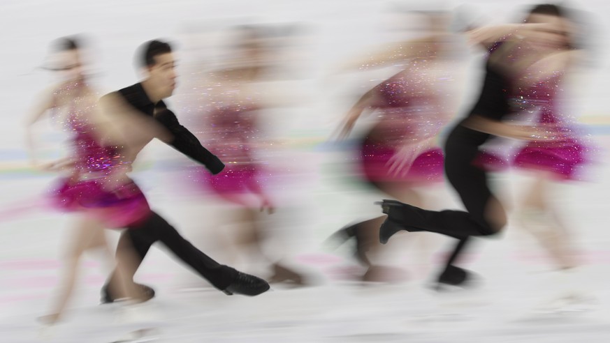 epa06541889 A multiple exposure image of Anna Cappellini and Luca Lanotte of Italy compete in the Ice Dance Short Dance of the Figure Skating competition at the Gangneung Ice Arena during the PyeongCh ...