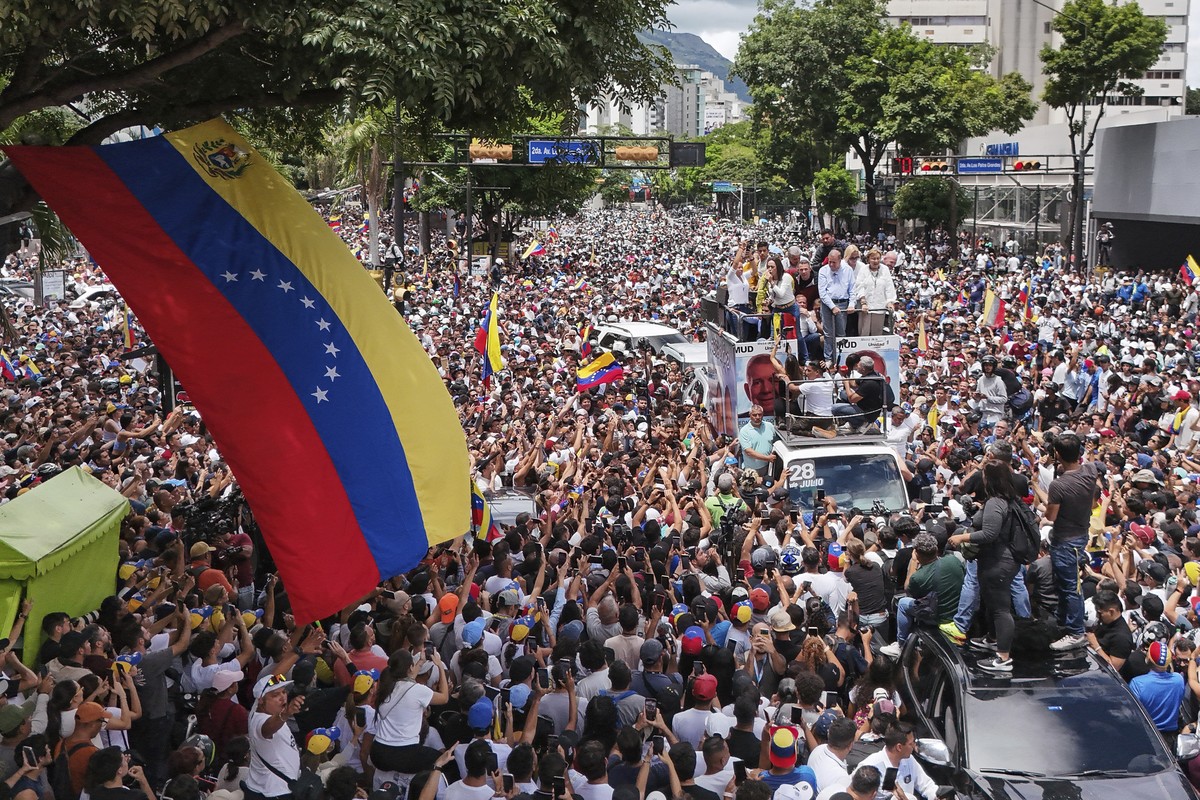 Opposition leader Maria Corina Machado and opposition candidate Edmundo Gonzalez ride atop a truck during a protest against official presidential election results declaring President Nicolas Maduro th ...