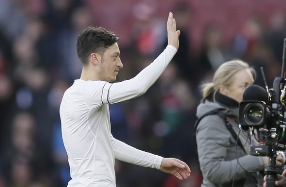 Arsenal&#039;s Mesut Ozil waves to his fans after the English Premier League soccer match between Arsenal and Burnley at the Emirates Stadium in London, Saturday, Dec. 22, 2018. (AP Photo/Tim Ireland)